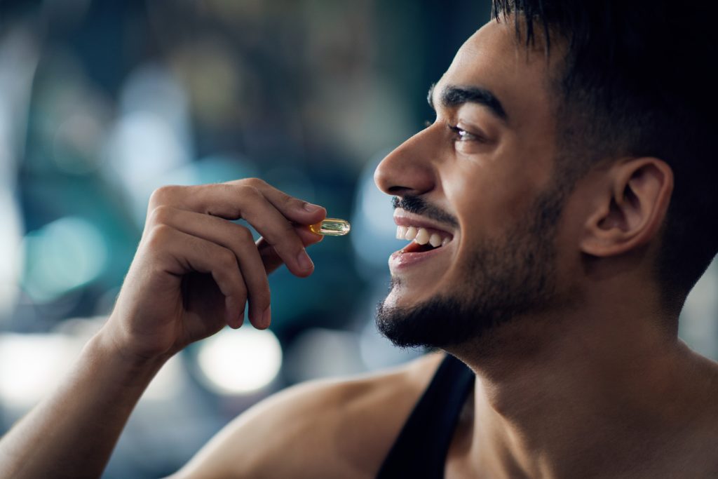 A man going to consume cbd capsule