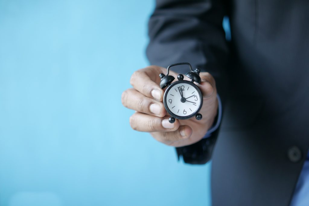 A man holding a watch